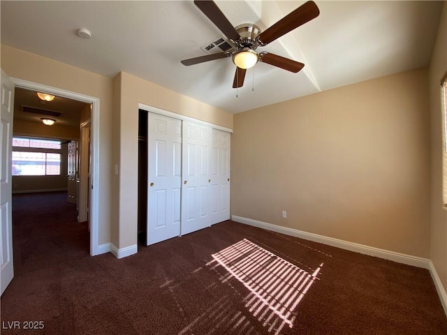 7604 Cruz Bay Ct, Las Vegas, NV 89128 - unfurnished bedroom featuring dark colored carpet, a closet, and a ceiling fan