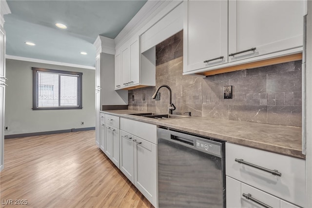 4272 Sheppard Dr, Las Vegas, NV 89121 - kitchen with dishwasher, white cabinetry, crown molding, decorative backsplash, and light wood-type flooring