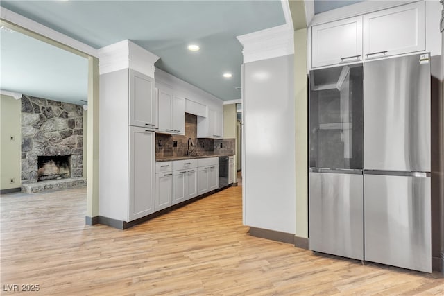 4272 Sheppard Dr, Las Vegas, NV 89121 - kitchen with smart refrigerator, light wood-type flooring, tasteful backsplash, recessed lighting, and a fireplace