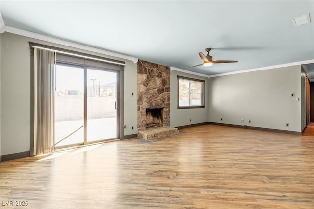 4272 Sheppard Dr, Las Vegas, NV 89121 - unfurnished living room with a ceiling fan, ornamental molding, light wood finished floors, and a fireplace