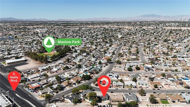 4272 Sheppard Dr, Las Vegas, NV 89121 - aerial overview of property's location featuring a mountainous background and nearby suburban area