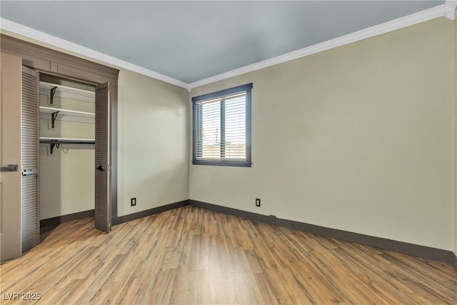 4272 Sheppard Dr, Las Vegas, NV 89121 - unfurnished bedroom featuring ornamental molding, wood finished floors, and a closet