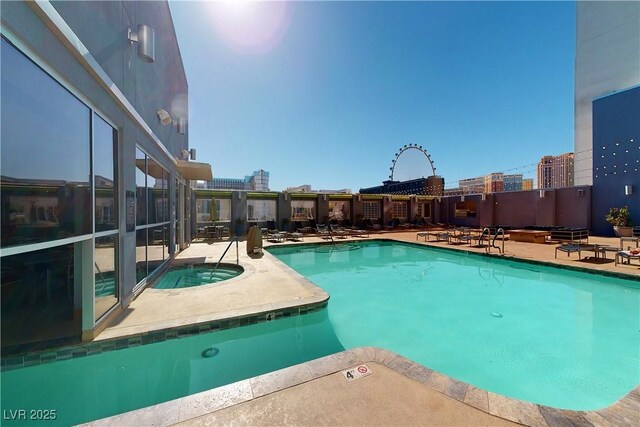 211 E Flamingo Rd Unit 202, Las Vegas, NV 89169 - community pool featuring a hot tub and a patio