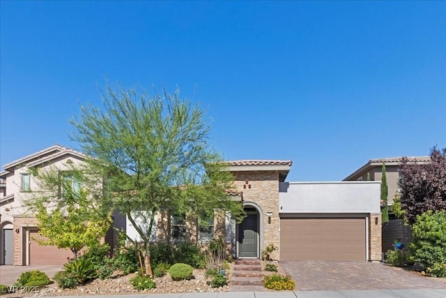 251 Castellari Dr, Las Vegas, NV 89138 - mediterranean / spanish home with a garage, driveway, stone siding, a tile roof, and stucco siding