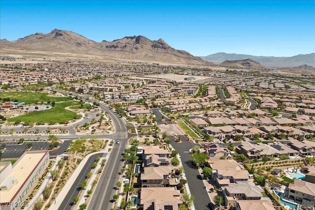 251 Castellari Dr, Las Vegas, NV 89138 - aerial view of property and surrounding area featuring a mountainous background and nearby suburban area