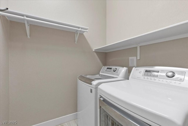 251 Castellari Dr, Las Vegas, NV 89138 - laundry room featuring washing machine and dryer and baseboards