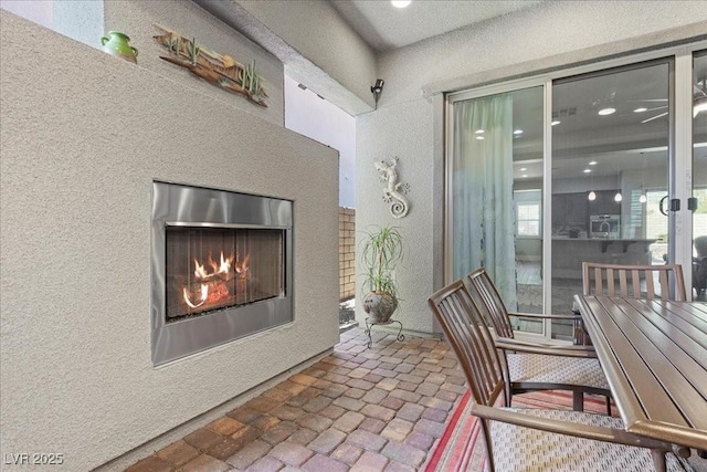 251 Castellari Dr, Las Vegas, NV 89138 - view of patio featuring a lit fireplace
