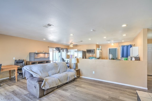 2450 Tournament St, Las Vegas, NV 89142 - living room with wood finished floors, recessed lighting, and a ceiling fan
