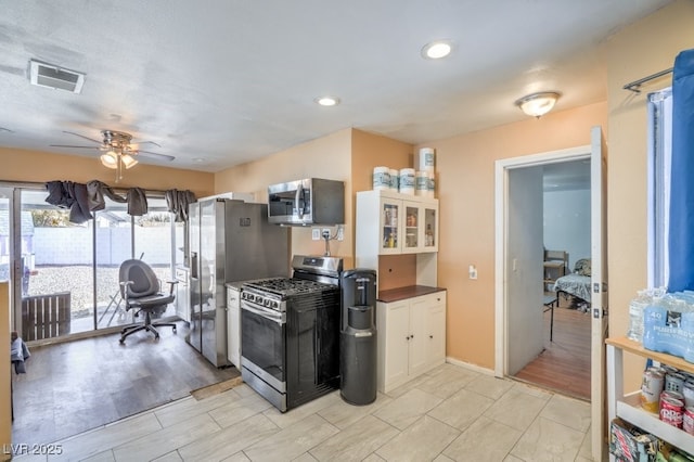 2450 Tournament St, Las Vegas, NV 89142 - kitchen featuring stainless steel appliances, a ceiling fan, dark countertops, and recessed lighting