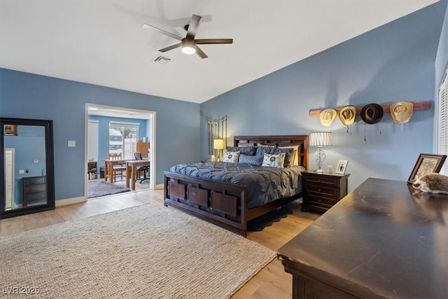 7675 Butterscotch Ct, Las Vegas, NV 89131 - bedroom with light wood-type flooring, lofted ceiling, and ceiling fan