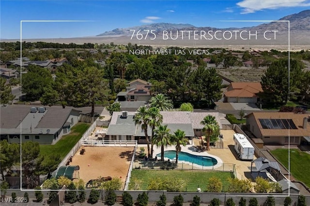 7675 Butterscotch Ct, Las Vegas, NV 89131 - aerial view of residential area with mountains and a pool area