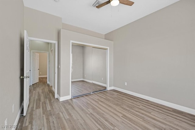 10700 Button Willow Dr, Las Vegas, NV 89134 - unfurnished bedroom featuring light wood-style floors, a closet, and a ceiling fan