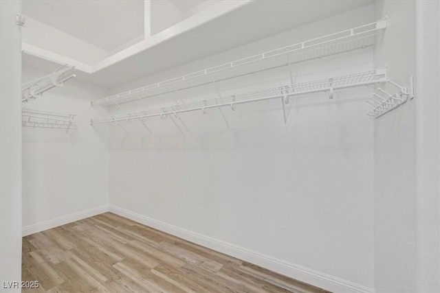 10700 Button Willow Dr, Las Vegas, NV 89134 - walk in closet featuring wood finished floors