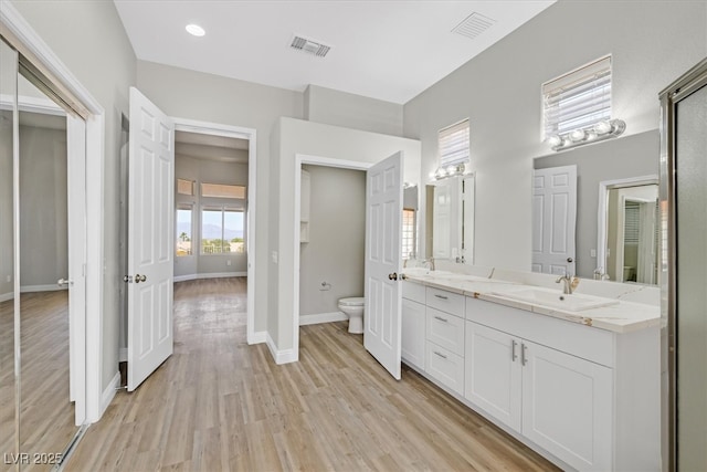 10700 Button Willow Dr, Las Vegas, NV 89134 - bathroom with double vanity and wood finished floors
