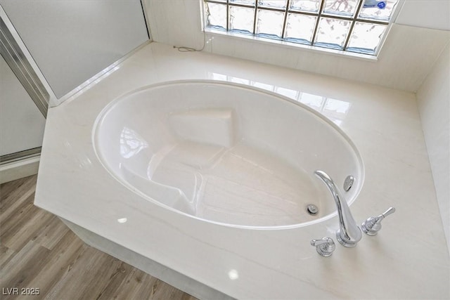 10700 Button Willow Dr, Las Vegas, NV 89134 - bathroom view of a garden tub and wood finished floors
