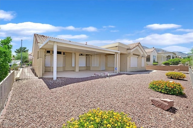 10700 Button Willow Dr, Las Vegas, NV 89134 - view of front facade featuring stucco siding, a tile roof, and a patio area