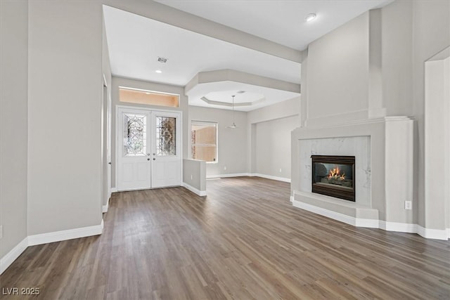 10700 Button Willow Dr, Las Vegas, NV 89134 - entrance foyer featuring wood finished floors, a fireplace, french doors, and a tray ceiling