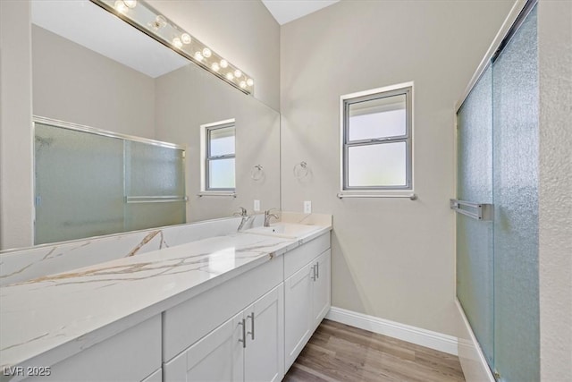 10700 Button Willow Dr, Las Vegas, NV 89134 - full bathroom featuring vanity, a stall shower, and wood finished floors