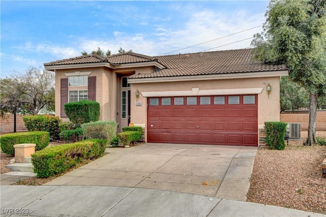 3200 Ridgecliff St, Las Vegas, NV 89129 - mediterranean / spanish-style house with stucco siding, an attached garage, concrete driveway, and a tile roof