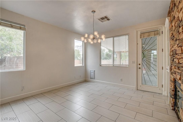 3200 Ridgecliff St, Las Vegas, NV 89129 - empty room with plenty of natural light and a chandelier