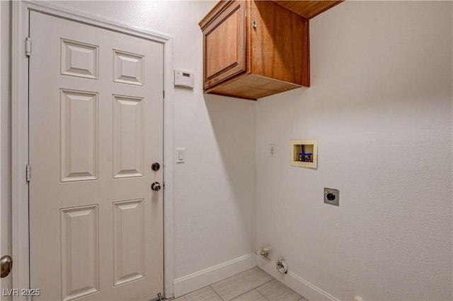 3200 Ridgecliff St, Las Vegas, NV 89129 - laundry area with hookup for a washing machine, electric dryer hookup, cabinet space, hookup for a gas dryer, and light tile patterned floors