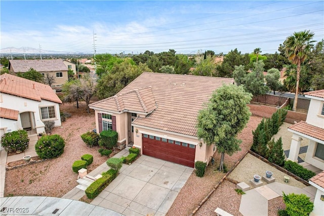 3200 Ridgecliff St, Las Vegas, NV 89129 - mediterranean / spanish home featuring driveway, a tiled roof, stucco siding, and an attached garage