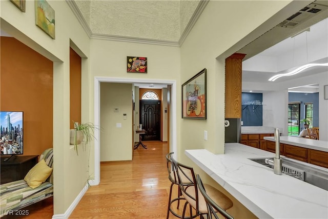 7909 Canoe Ln, Las Vegas, NV 89145 - hall with light wood finished floors and ornamental molding