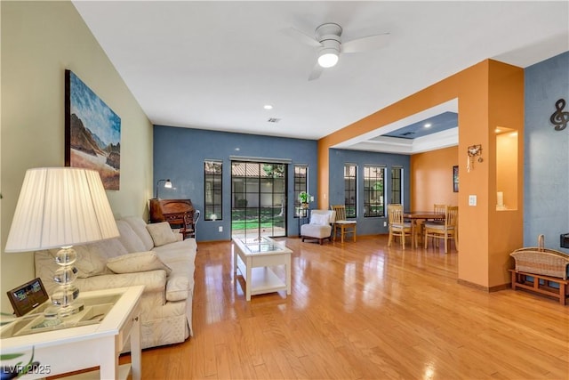 7909 Canoe Ln, Las Vegas, NV 89145 - living room with light wood finished floors and a ceiling fan