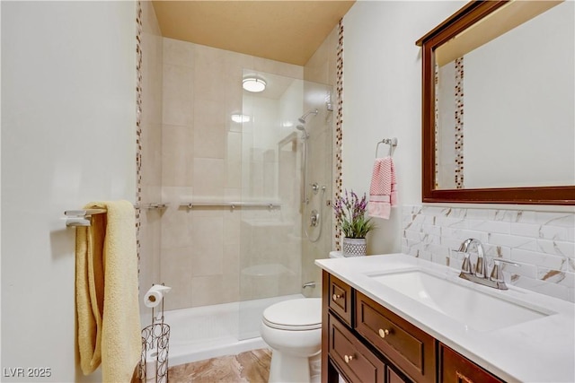 7909 Canoe Ln, Las Vegas, NV 89145 - bathroom featuring a shower stall, vanity, and backsplash