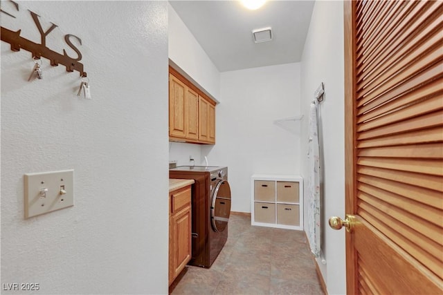 7909 Canoe Ln, Las Vegas, NV 89145 - laundry area with washing machine and clothes dryer and cabinet space