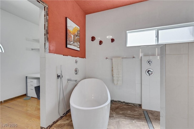 7909 Canoe Ln, Las Vegas, NV 89145 - bathroom featuring a freestanding bath and a walk in shower