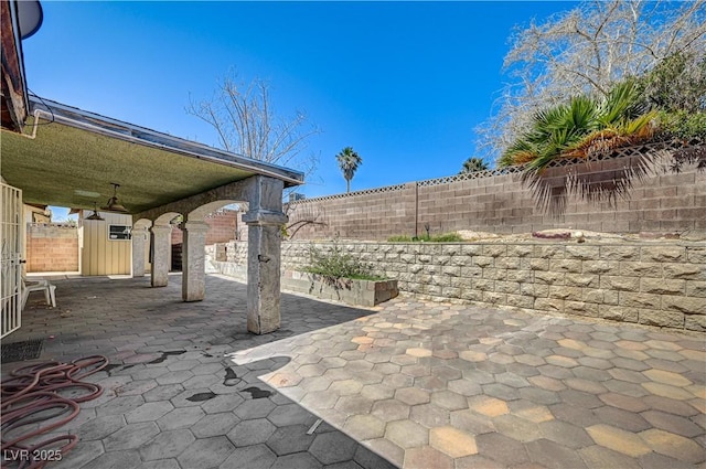 5121 Gains Mill St, Las Vegas, NV 89122 - fenced backyard featuring a patio area