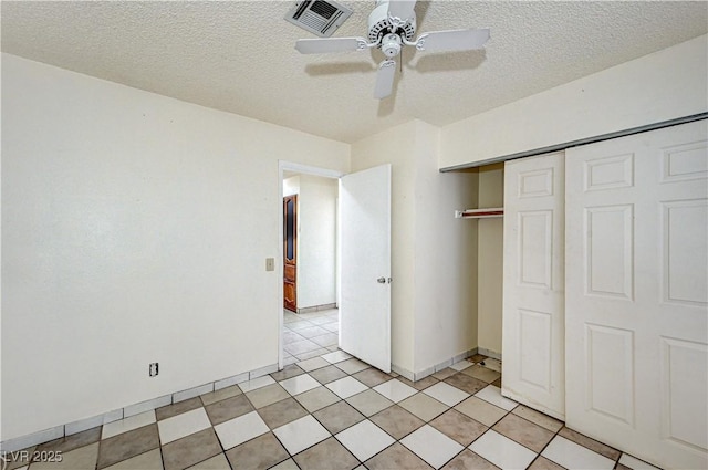 5121 Gains Mill St, Las Vegas, NV 89122 - unfurnished bedroom with a closet, a textured ceiling, and ceiling fan