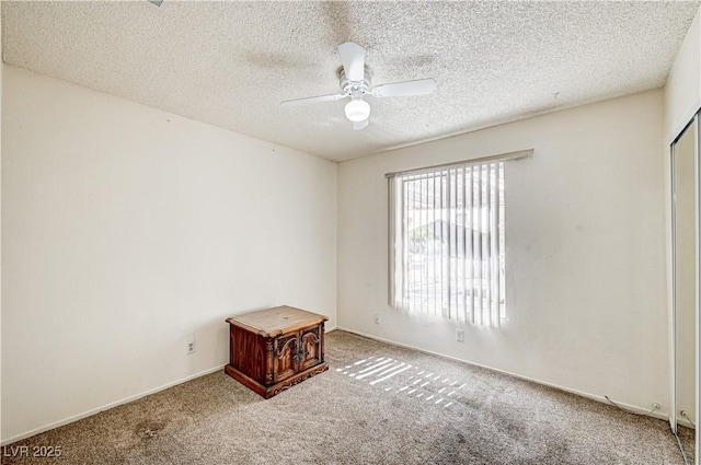 5121 Gains Mill St, Las Vegas, NV 89122 - empty room with carpet floors, a ceiling fan, and a textured ceiling