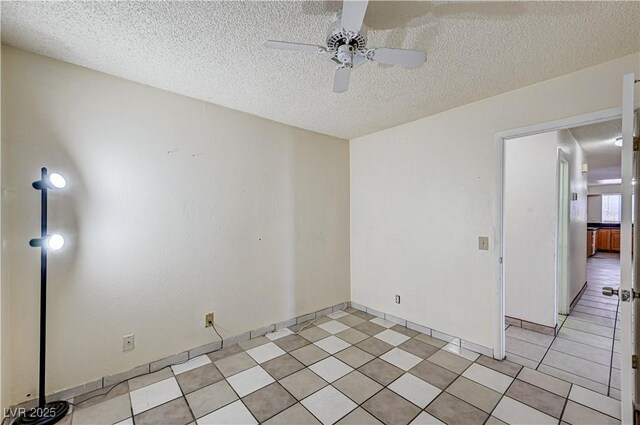 5121 Gains Mill St, Las Vegas, NV 89122 - empty room with a ceiling fan and a textured ceiling