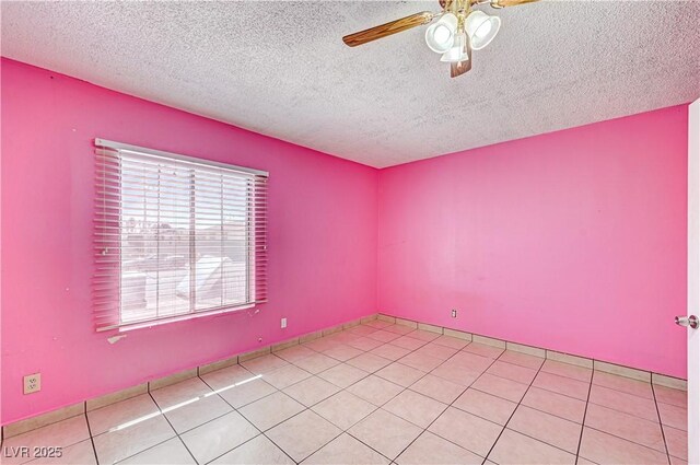 5121 Gains Mill St, Las Vegas, NV 89122 - empty room with a ceiling fan, a textured ceiling, and light tile patterned floors