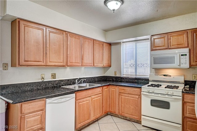 5121 Gains Mill St, Las Vegas, NV 89122 - kitchen with white appliances, a textured ceiling, and light tile patterned floors