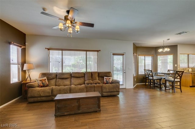 6109 Sandstone Mesa Dr, Las Vegas, NV 89130 - living room with wood finished floors, a ceiling fan, and healthy amount of natural light