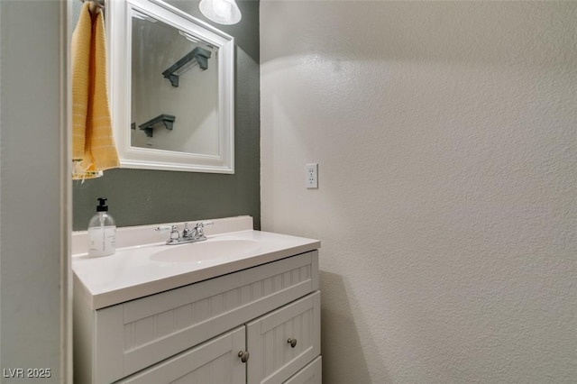 6109 Sandstone Mesa Dr, Las Vegas, NV 89130 - bathroom with vanity and a textured wall