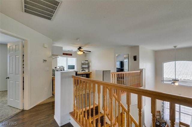 6109 Sandstone Mesa Dr, Las Vegas, NV 89130 - hallway featuring an upstairs landing and dark wood finished floors