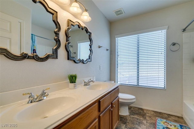 6109 Sandstone Mesa Dr, Las Vegas, NV 89130 - full bathroom with double vanity, bathing tub / shower combination, and stone finish flooring
