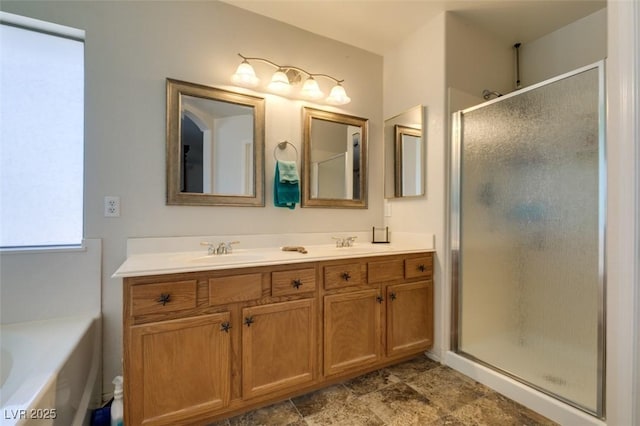 6109 Sandstone Mesa Dr, Las Vegas, NV 89130 - bathroom featuring a stall shower, double vanity, and a bath