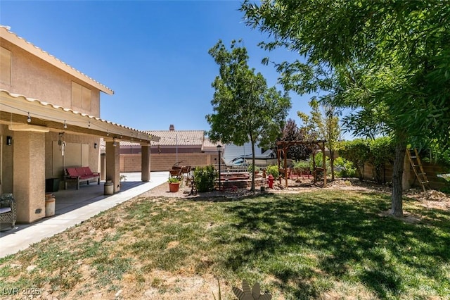 6109 Sandstone Mesa Dr, Las Vegas, NV 89130 - fenced backyard featuring a patio area and a pergola