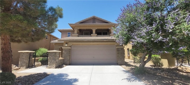 5413 Bristol Bend Ct, Las Vegas, NV 89135 - view of front of property with driveway, an attached garage, and stone siding