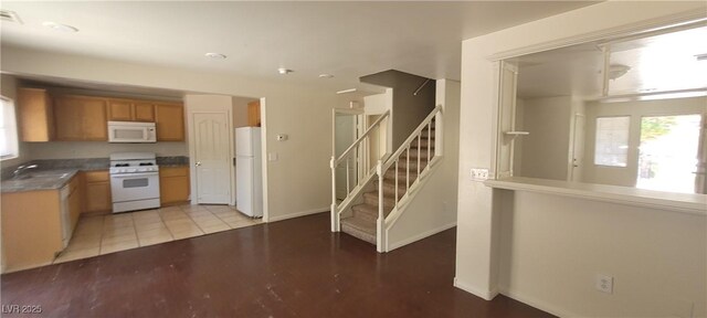 5413 Bristol Bend Ct, Las Vegas, NV 89135 - kitchen with white appliances, brown cabinets, and recessed lighting
