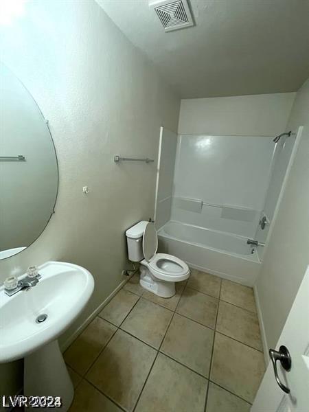 5413 Bristol Bend Ct, Las Vegas, NV 89135 - bathroom featuring tile patterned floors and washtub / shower combination