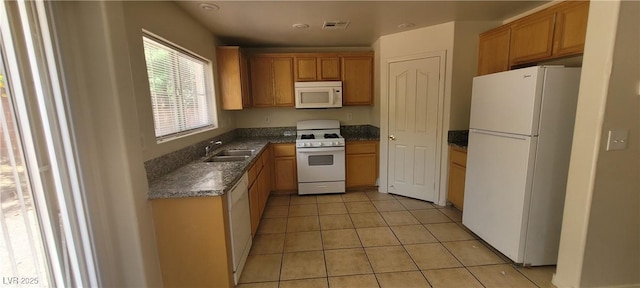 5413 Bristol Bend Ct, Las Vegas, NV 89135 - kitchen with white appliances and light tile patterned floors