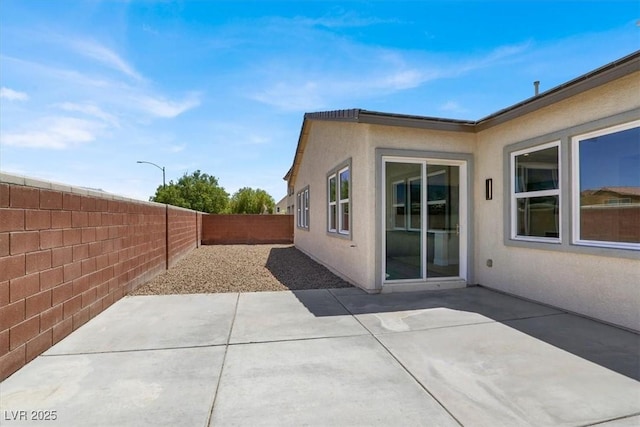 5908 Big Horn View St, North Las Vegas, NV 89031 - fenced backyard with a patio