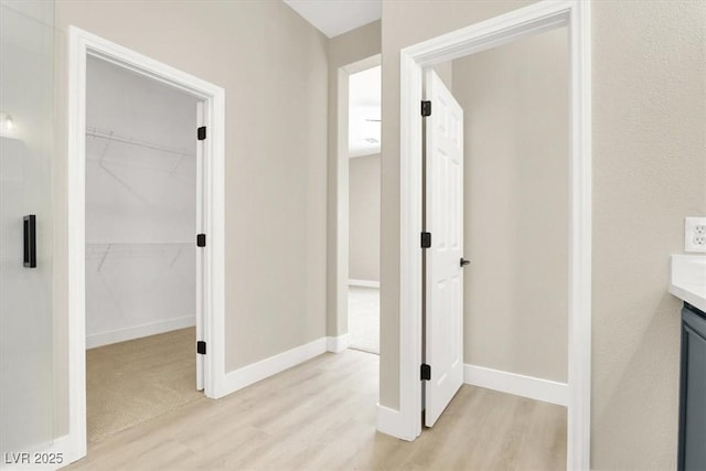 5908 Big Horn View St, North Las Vegas, NV 89031 - corridor featuring light wood-style floors and baseboards