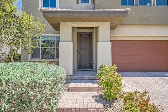 10693 Harvest Green Way, Las Vegas, NV 89135 - property entrance with stucco siding and a garage